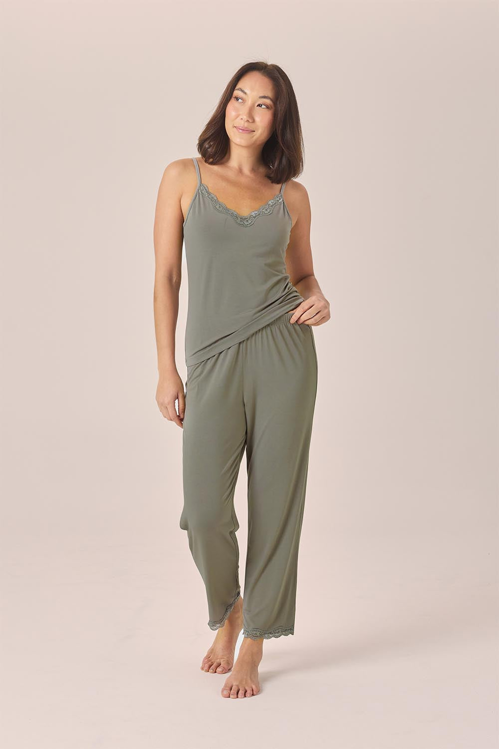 Woman wearing the Britt Bamboo Lace Cami Long PJ Set in Olive, front view of lace cami and full-length pants