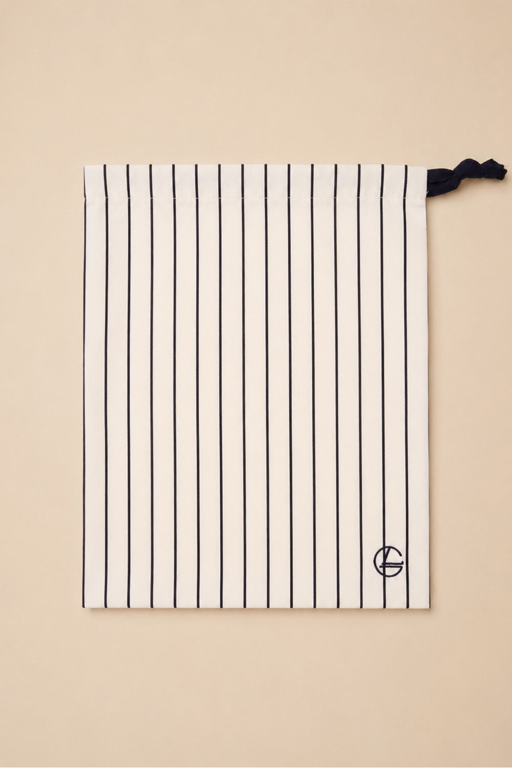 Willow Cotton Stripe PJ Set in Ivory shown with its matching ivory striped drawstring bag
