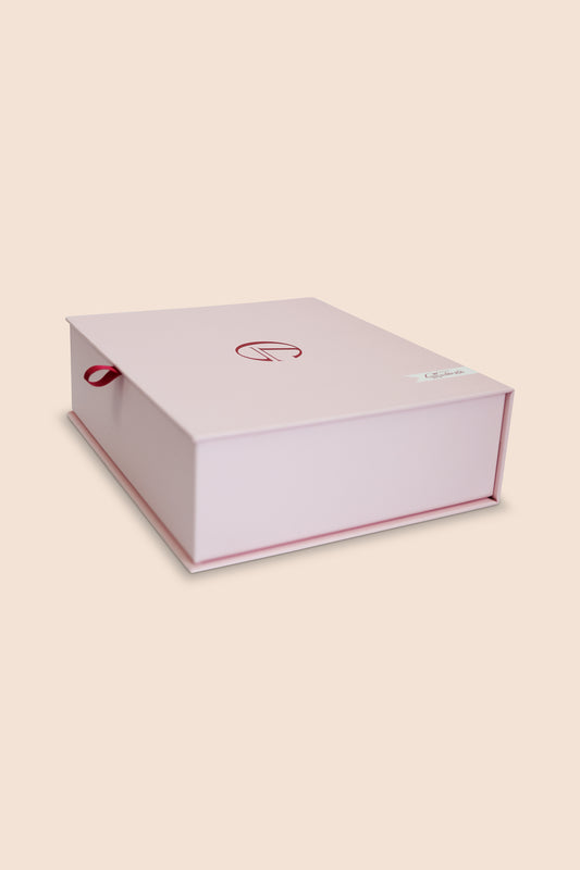 White box with red accents on a beige background