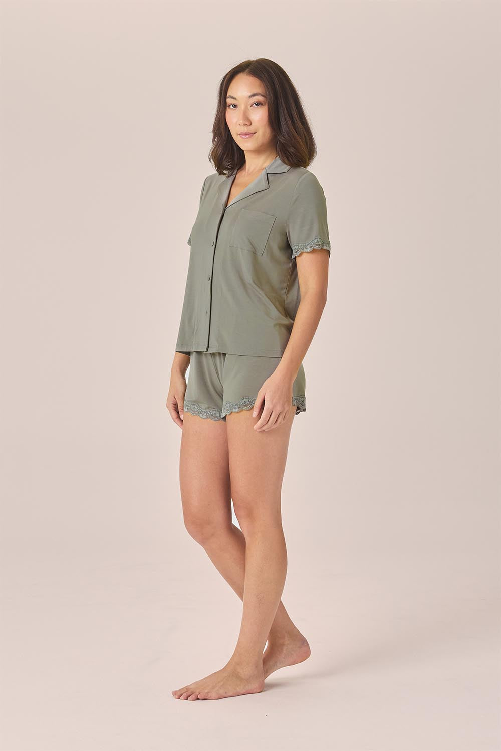 Woman wearing the Joni Bamboo Short Set with Lace in Olive, angled front view