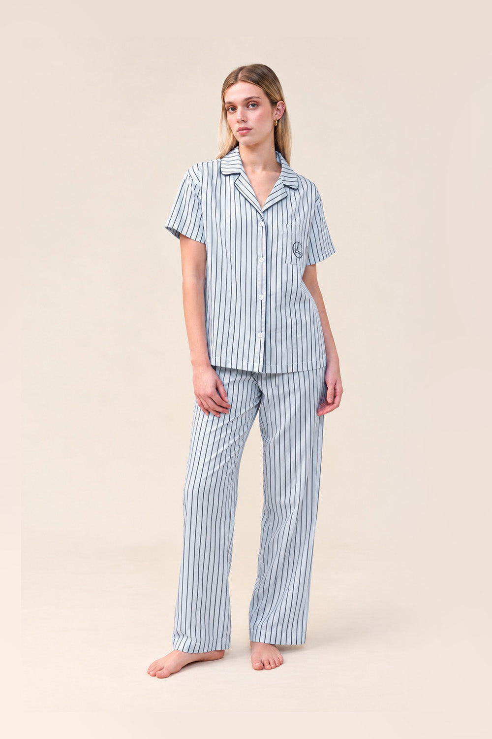 Woman wearing the Lisa Stripe Long Pant PJ Set in Blue, front view of short sleeve shirt and long pants