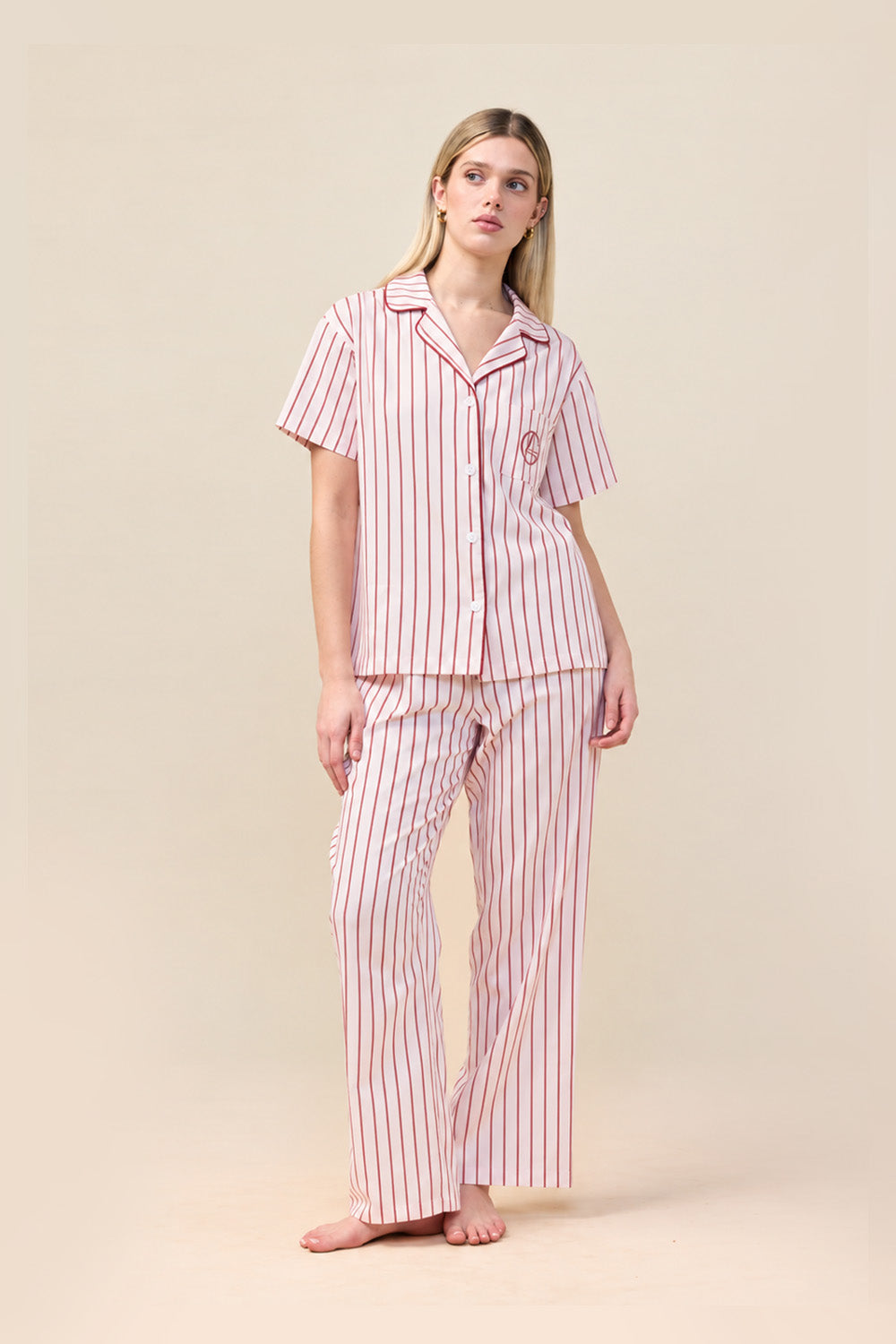 Woman wearing the Lisa Stripe Long Pant PJ Set in Pink, front view of short sleeve shirt and long pants