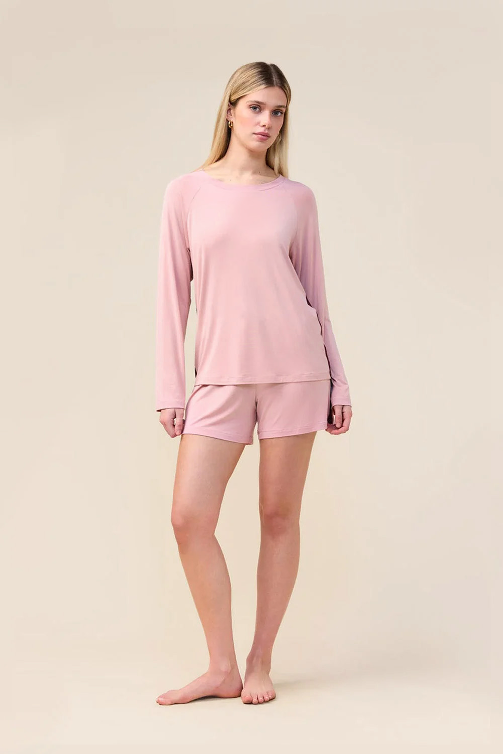 Woman wearing the Solene Long Sleeve Top with Stripe in Pink, front view