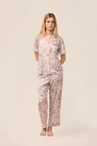 Woman wearing the Millie Bambi Print Long PJ Set in Brown, front view of short sleeve shirt and long pants