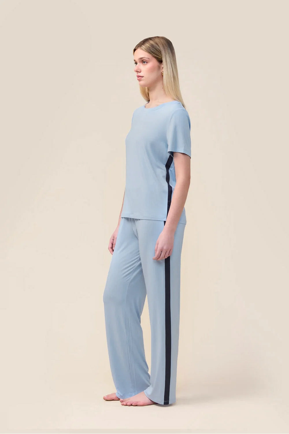 Woman wearing the Inez Bamboo Pant with Stripe in Blue, side view