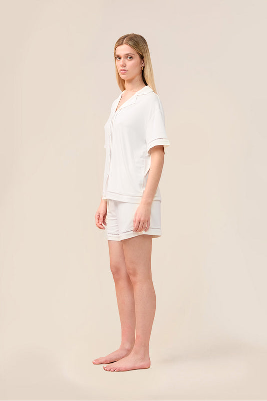 Woman wearing the Helena Short Bamboo PJ Set in Ecru, angled front view