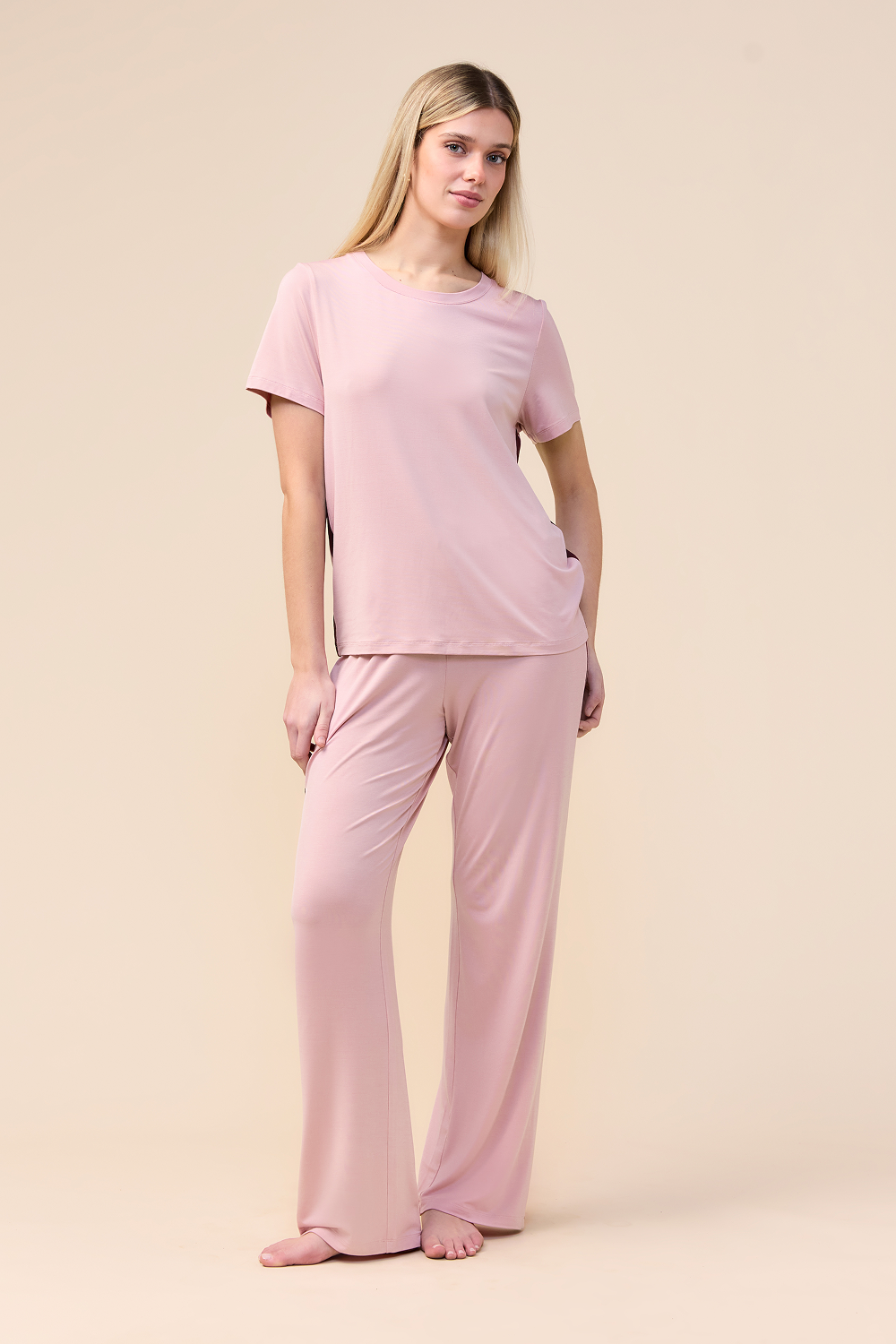 Woman wearing the Inez Bamboo Pant with Stripe in Pink, front view