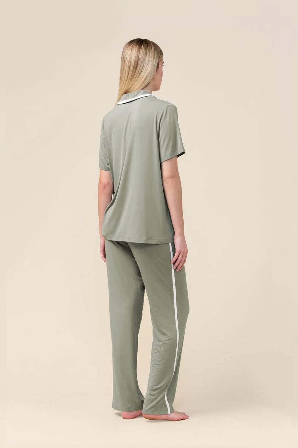 Woman wearing the Vanessa Bamboo Long Pant PJ Set in Olive, back view showing the white side stripe