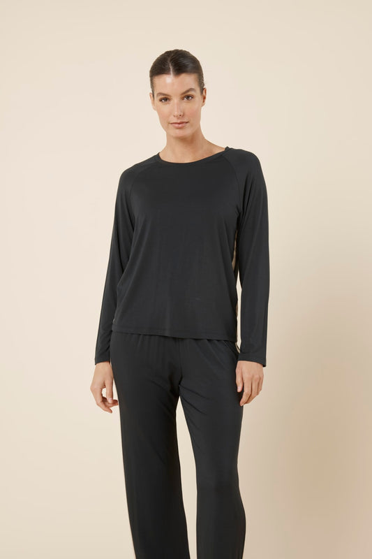 Woman wearing Anya Bamboo Sporty PJ Set Black standing facing forward, showing the comfortable bamboo fabric and relaxed lounge fit.