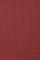 Close-up of a ribbed red fabric texture of the Athens ribbed Long pant burgundy