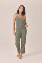 Woman wearing the Britt Bamboo Lace Cami Long PJ Set in Olive, front view of lace cami and full-length pants