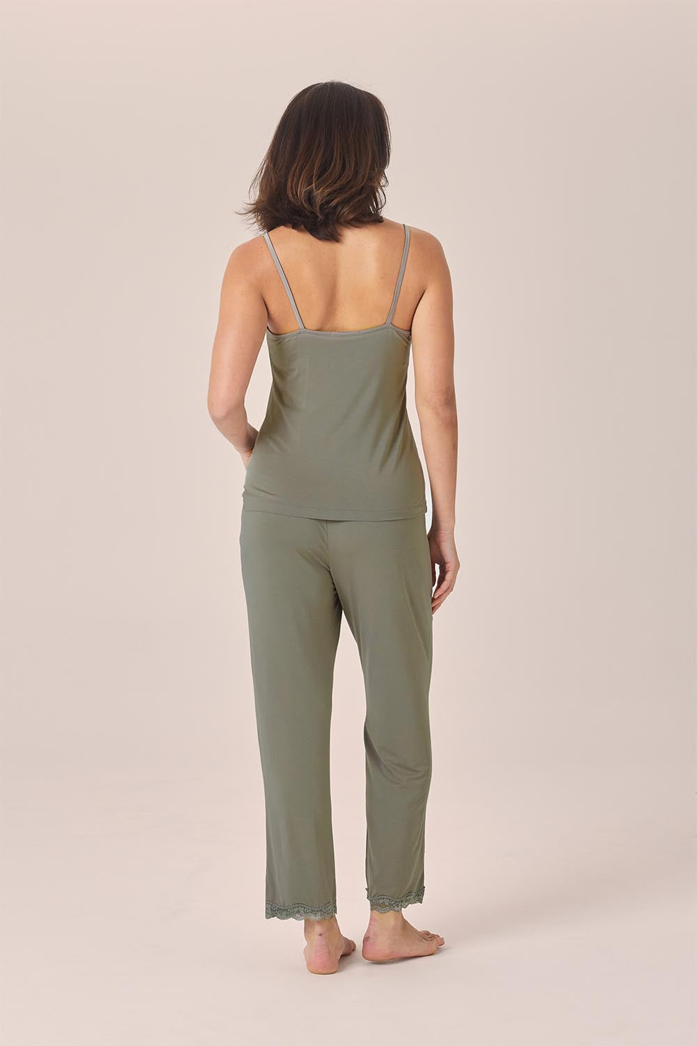 Woman wearing the Britt Bamboo Lace Cami Long PJ Set in Olive, back view