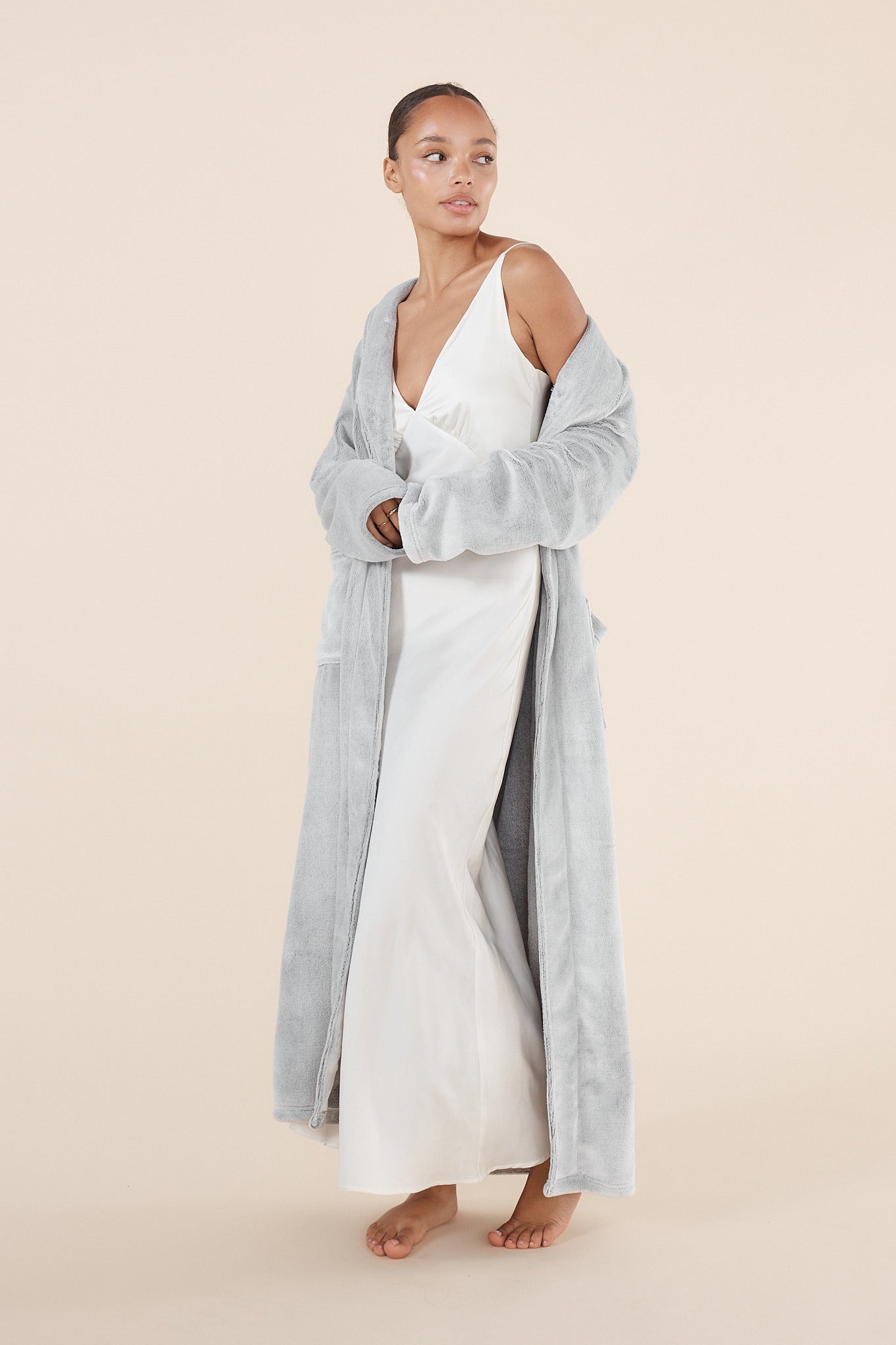 Woman wearing Desire Grey Long Plush Robe styled open over sleepwear showing soft plush fabric texture
