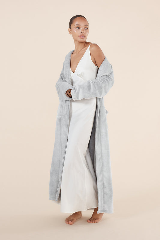 Woman wearing Desire Grey Long Plush Robe styled open over sleepwear showing soft plush fabric texture
