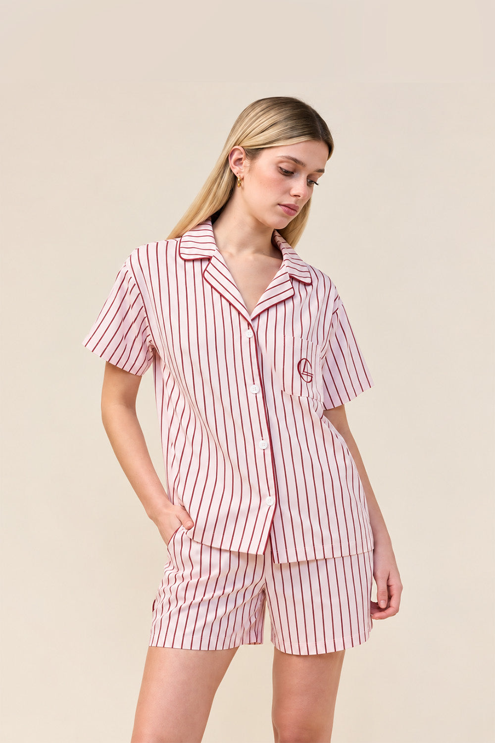 Woman wearing the Poppy Stripe Short PJ Set in Pink, alternate front view