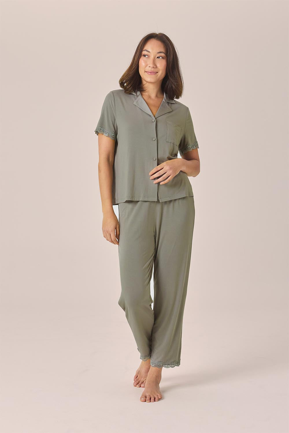 Woman wearing the Dianne Bamboo Long PJ Set with Lace in Olive, front view of short sleeve shirt and full-length pants