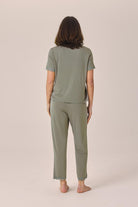 Woman wearing the Dianne Bamboo Long PJ Set with Lace in Olive, back view