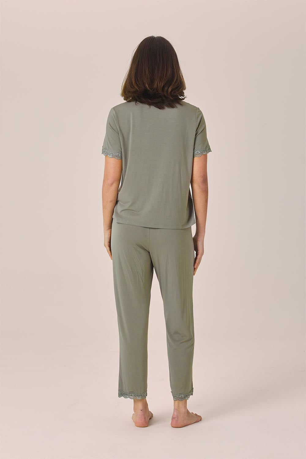 Woman wearing the Dianne Bamboo Long PJ Set with Lace in Olive, back view