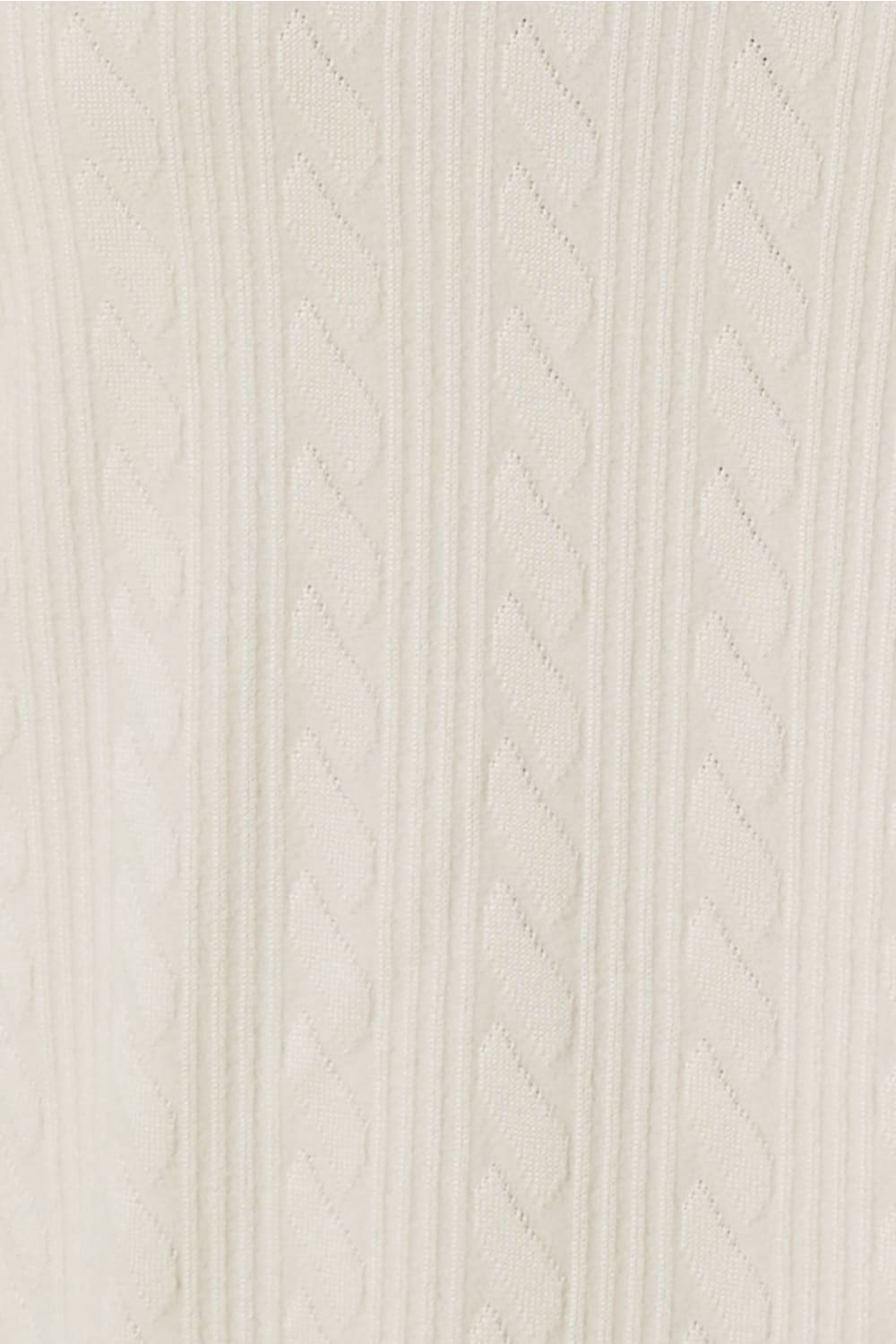 Close-up of a ivory textured fabric of the ellie lightweight velour cable knit showing the pattern