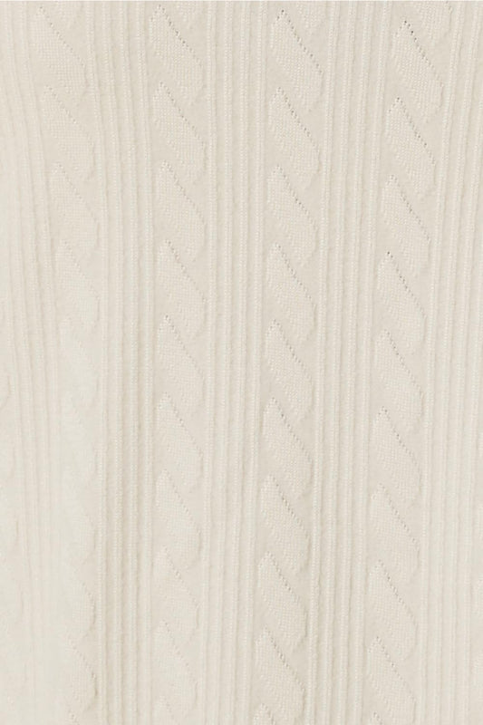 Close-up of a ivory textured fabric of the ellie lightweight velour cable knit showing the pattern