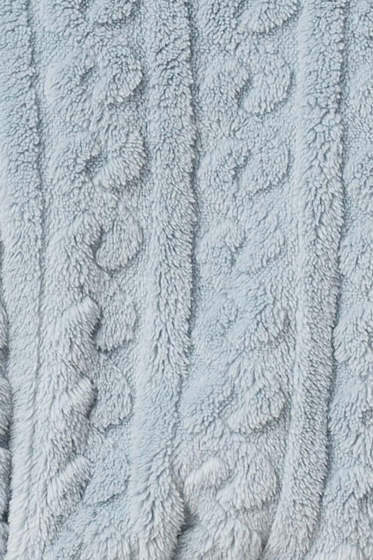 Close-up of textured light blue fabric with cable knit of the Gabriella Plush Long Robe