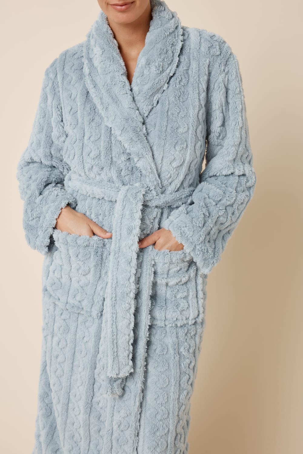 Light blue textured Gabriella Plush Long Robe worn by a woman with hand in pockets front on view