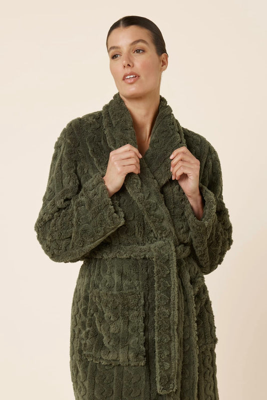 Woman wearing a tied up green olive Gabriella Plush Long Robe holding the neckline
