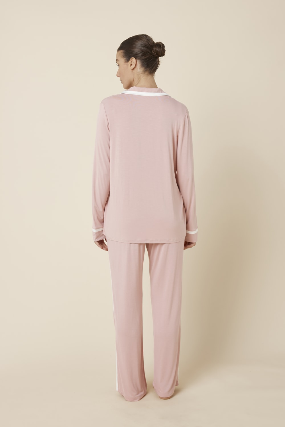 Woman wearing Grace Bamboo PJ Set Pink back view showing long sleeve shirt and full length pants