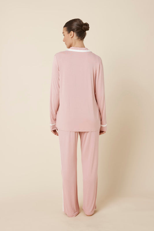 Woman wearing Grace Bamboo PJ Set Pink back view showing long sleeve shirt and full length pants
