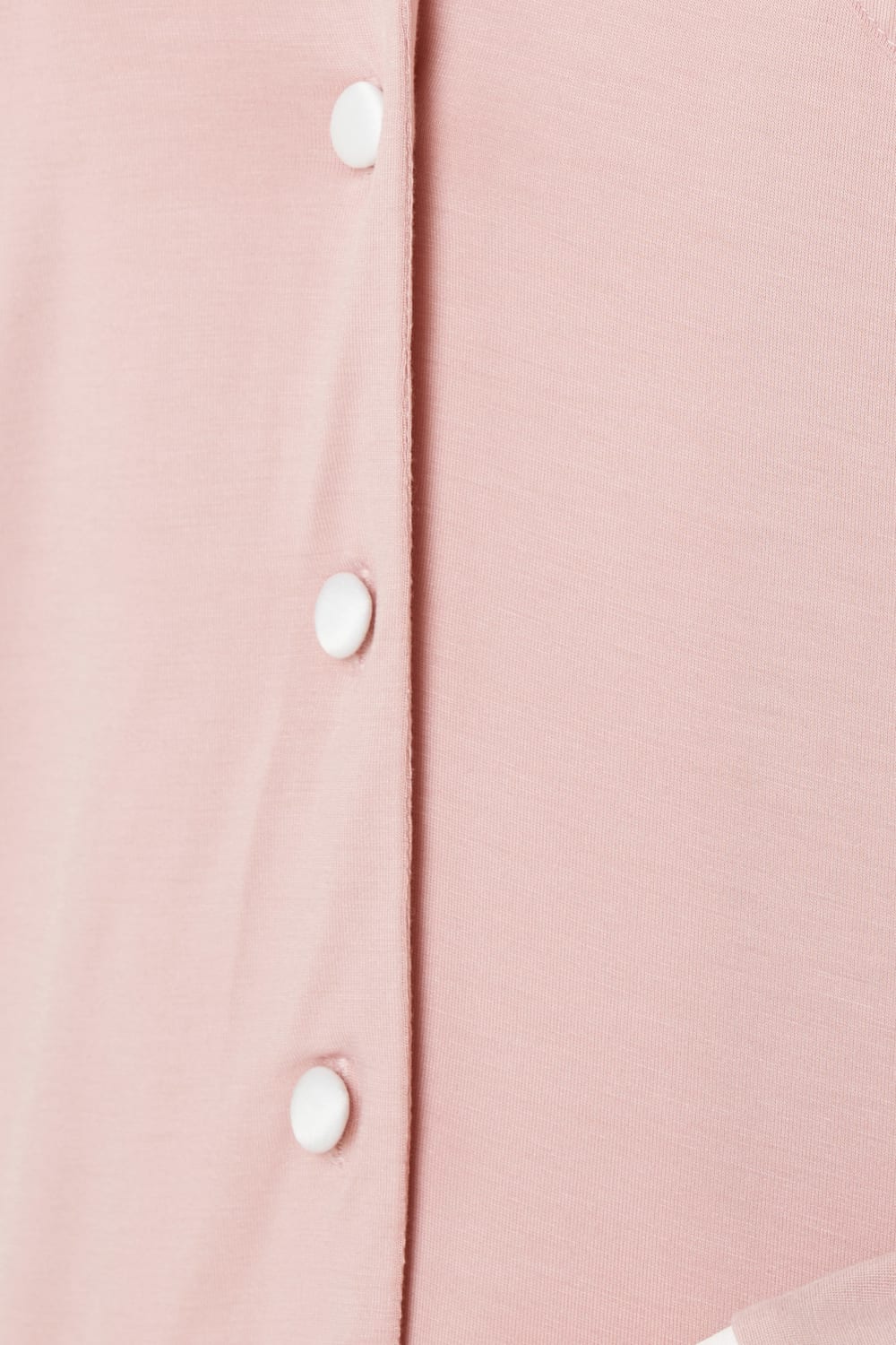 Close up of Grace Bamboo PJ Set Pink bamboo fabric with contrast buttons and piping detail