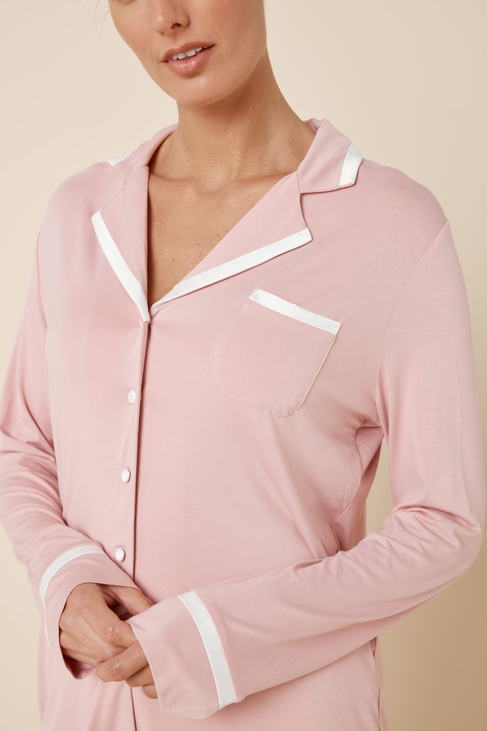 Woman wearing Grace Bamboo PJ Set Pink close up showing collar, chest pocket and contrast piping detail