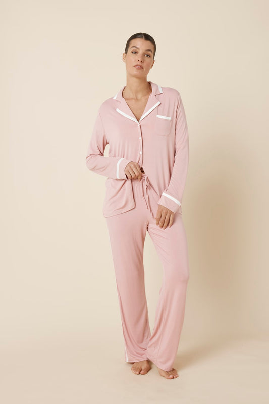 Woman wearing Grace Bamboo PJ Set Pink front view showing button shirt and relaxed straight leg pants
