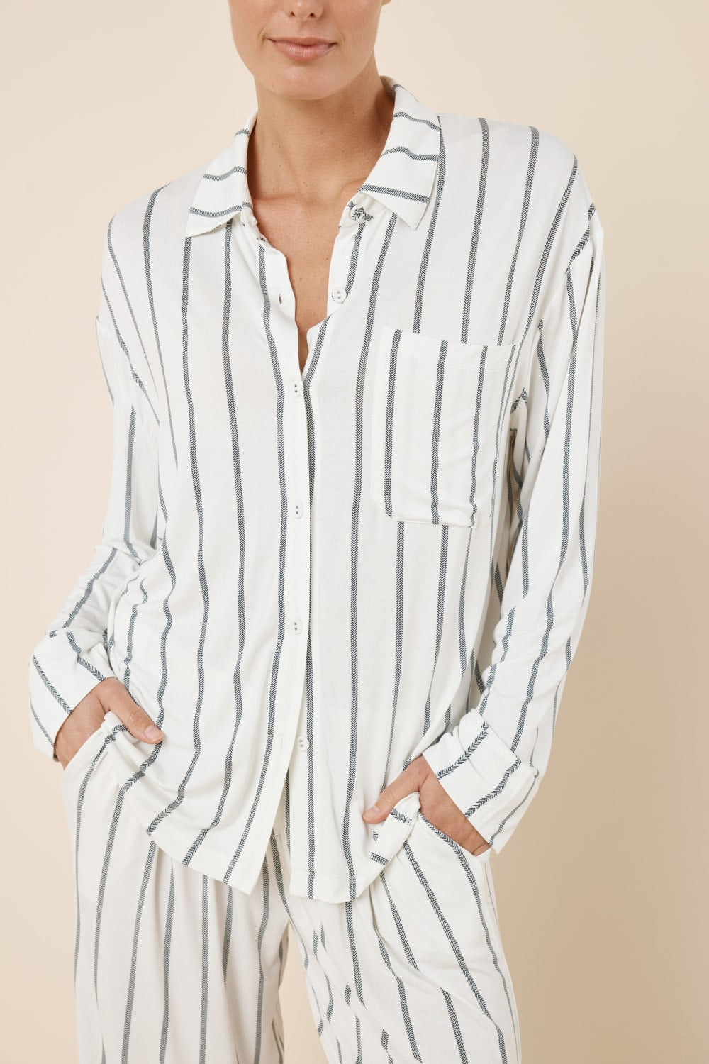 Person wearing a Harlow Bamboo Striped pyjama PJ Set Ivory front detail view of the button up top