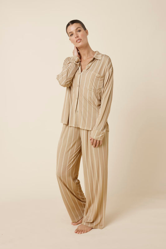 Woman wearing Harlow Bamboo Striped pyjama PJ Set in biscuit with white stripes from a side on view