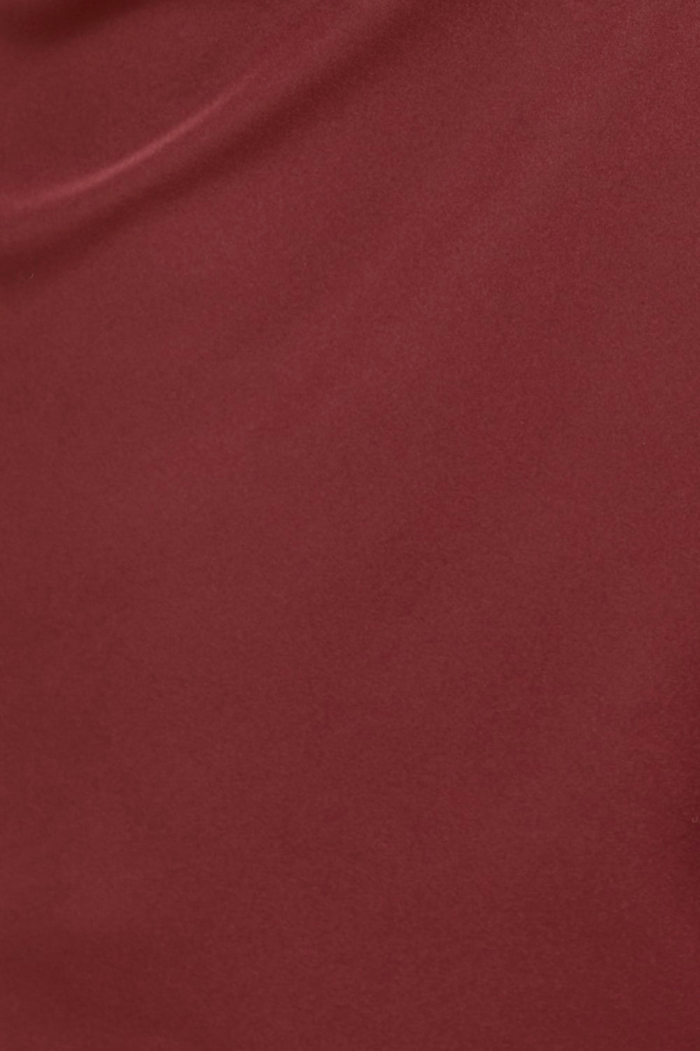 Close-up of a textured brown fabric surface