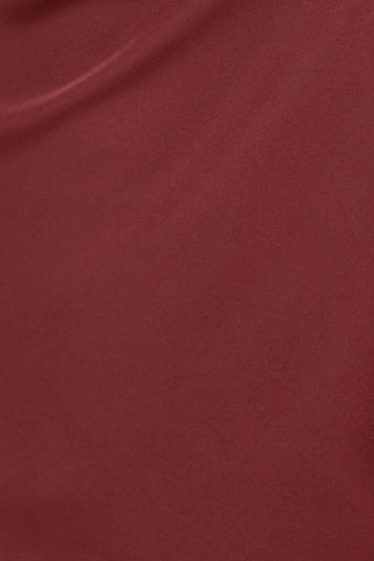 Close-up of a textured brown fabric surface