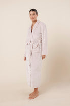 Woman wearing Imogin Pink Plush Robe side view showing relaxed maxi length silhouette