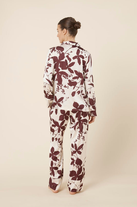 Person wearing a Ivy Silky Satin pyjama PJ set from the back view