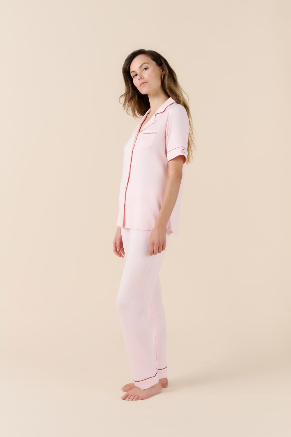 Woman wearing a pink Jenna Bamboo Long Pyjama PJ Set from side on view
