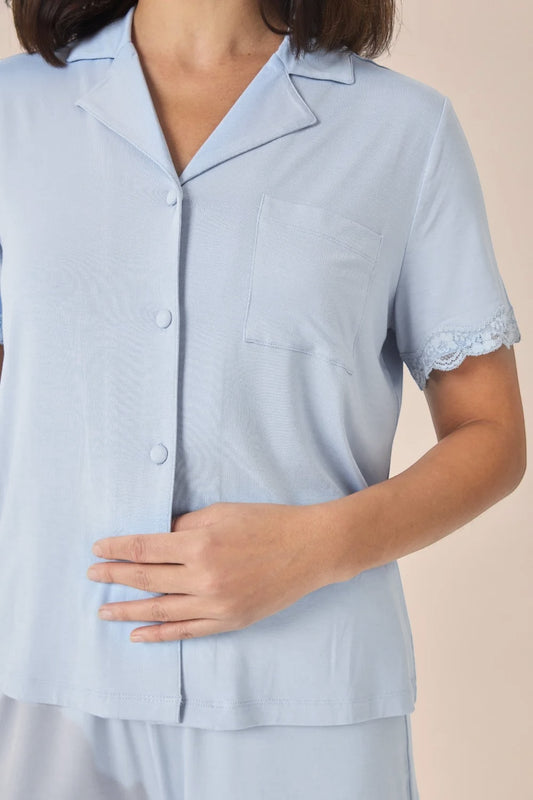 Close-up of the Joni Bamboo Short Set with Lace in Blue, showing the collar, pocket and lace-trimmed sleeve