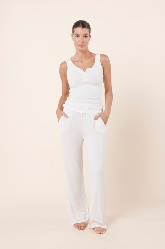 Woman wearing Liberty Ribbed Singlet Henley Top Ivory front view with ribbed texture and henley button detail