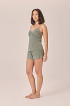 Woman wearing the Mabel Bamboo Cami and Short Set in Olive, angled front view