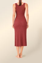 Woman wearing Monique Long Sleeveless Henley Dress Burgundy full length back view showing fitted ribbed midi silhouette