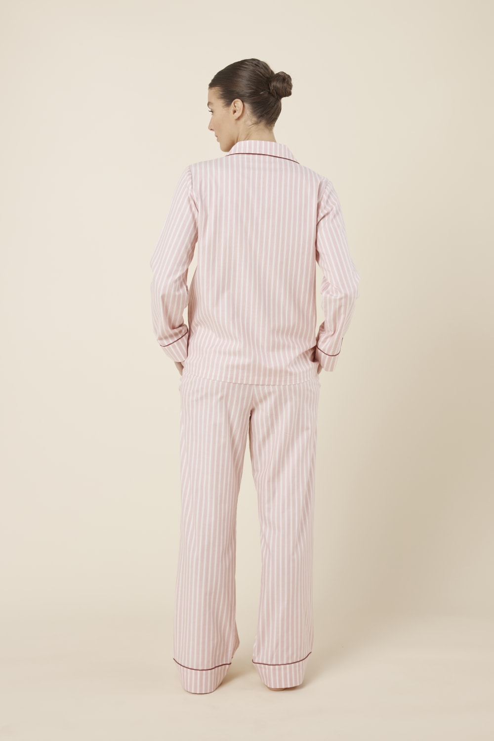 Woman wearing Octavia Cotton Stripe PJ Set Pink, back view of breathable cotton pyjama set with piped cuffs