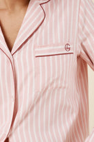 Woman wearing Octavia Cotton Stripe PJ Set Pink, close up of chest pocket with monogram embroidery detail