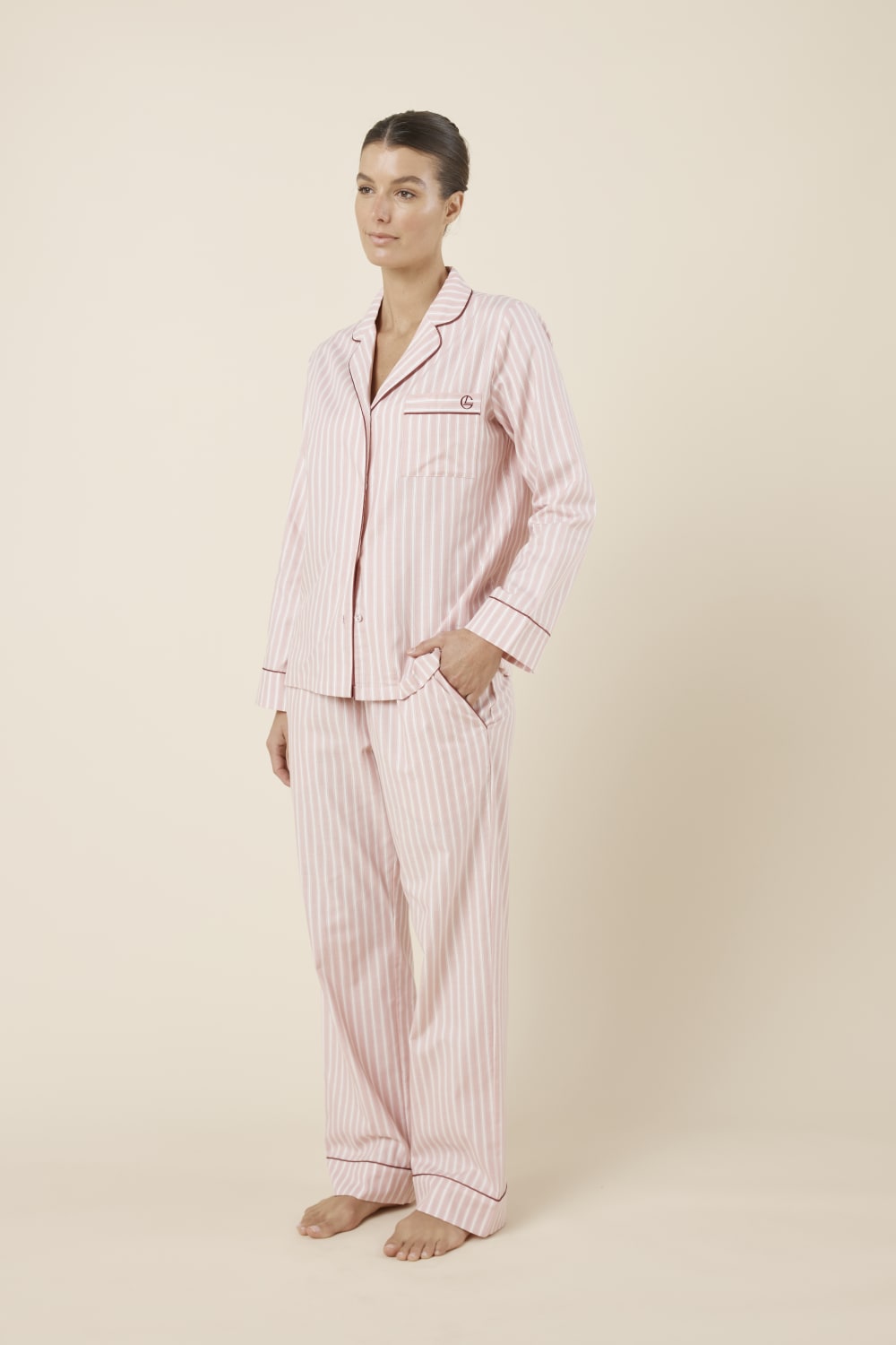 Woman wearing Octavia Cotton Stripe PJ Set Pink, side view of lightweight striped cotton sleepwear with straight leg pants