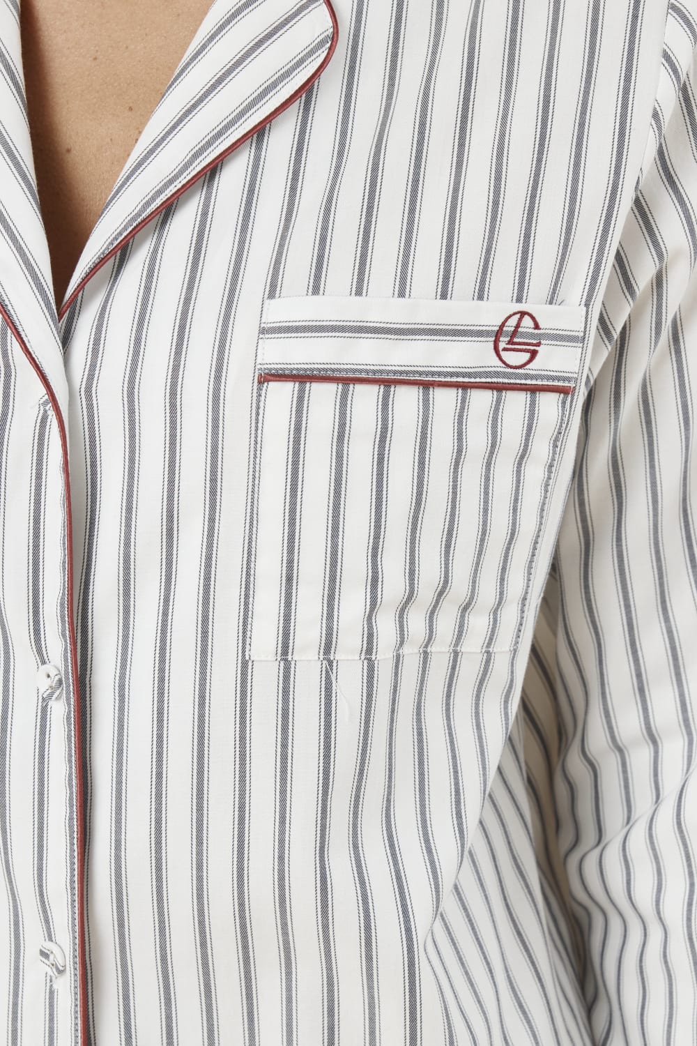 Octavia Cotton Stripe PJ Set close up of striped cotton shirt pocket with monogram embroidery and red piping