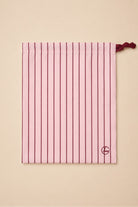 Willow Cotton Stripe PJ Set in Pink shown with its matching pink striped drawstring bag
