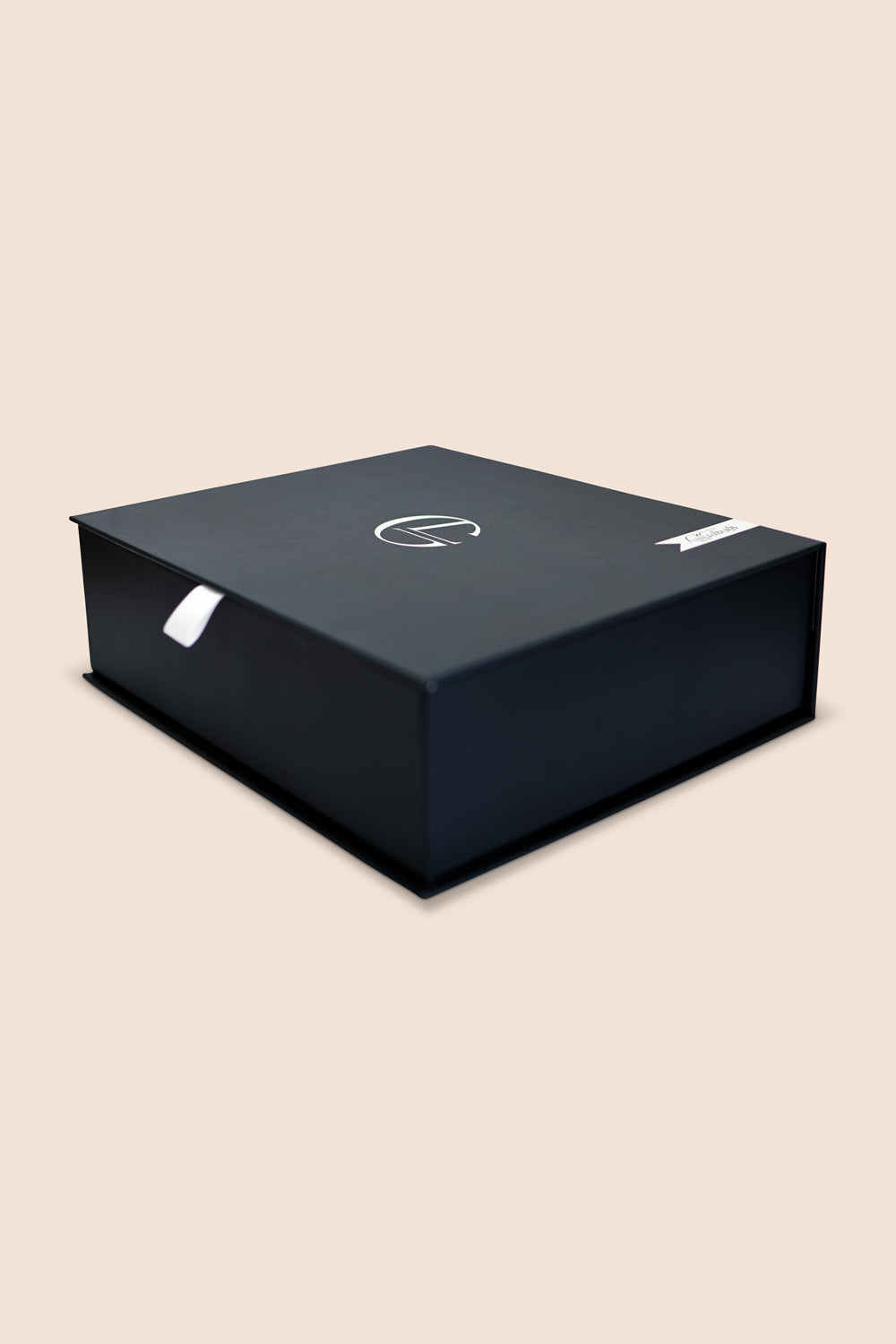 Black box with a logo on a beige background