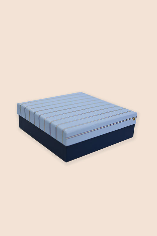 Blue and navy striped mattress on a beige background
